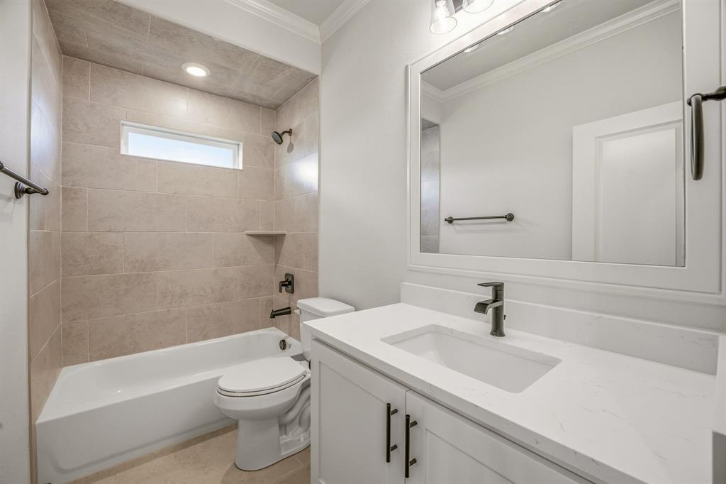 3155 Infinity Drive Weatherford, TX 76087 - Photo 28 of 39 Bathroom featuring vanity, washtub / shower combination, ornamental molding, and recessed lighting