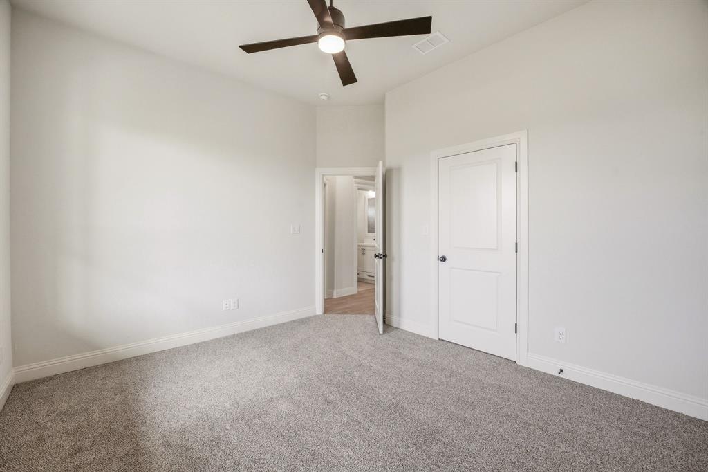 3155 Infinity Drive Weatherford, TX 76087 - Photo 30 of 39 Unfurnished bedroom featuring light colored carpet and ceiling fan