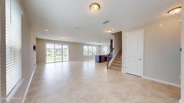 a view of a livingroom with hardwood floor and a window