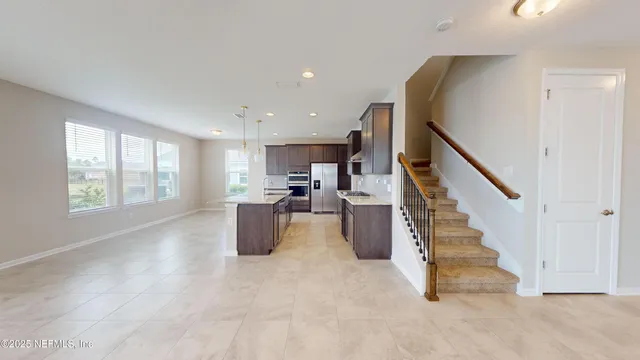 a view of kitchen with furniture and staircase