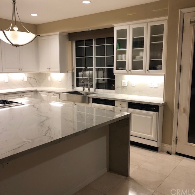 28362 Via Pasito San Juan Capistrano, CA 92675 - Photo 11 of 14 a kitchen with a sink and cabinets