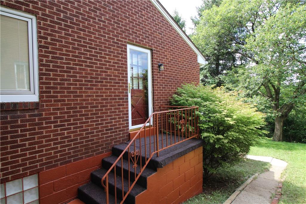 10109 Pearl Road Pittsburgh, PA 15235 - Photo 18 of 23 New security door on the side porch leads to the kitchen and offers convenient access to the yard.
