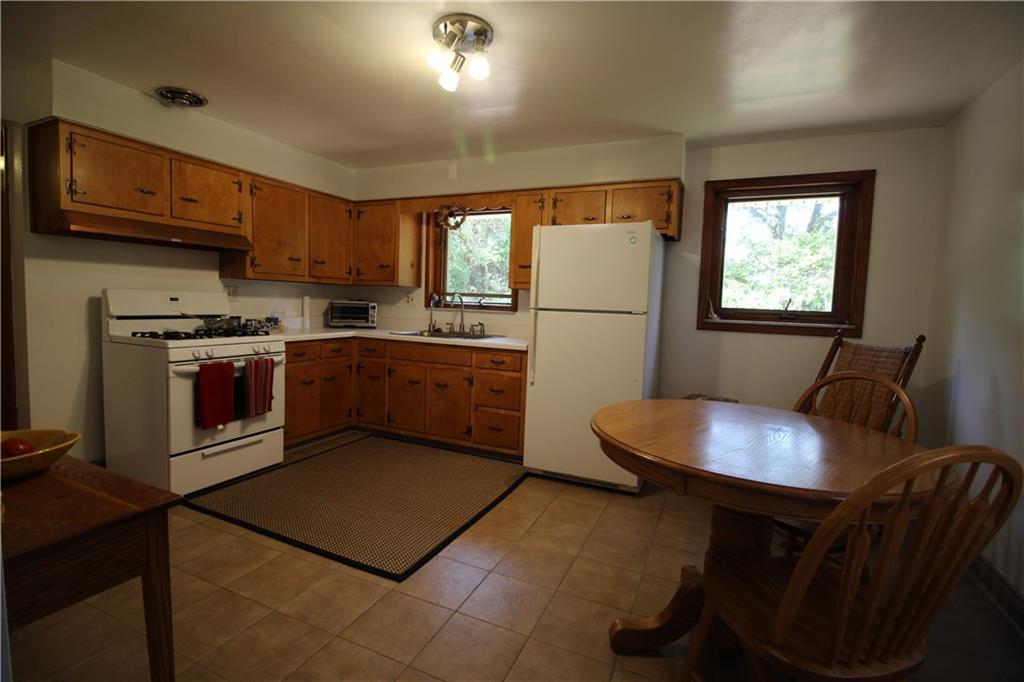 10109 Pearl Road Pittsburgh, PA 15235 - Photo 4 of 23 The large eat-in kitchen offers plentiful storage and beautiful and easy to clean ceramic tile flooring.