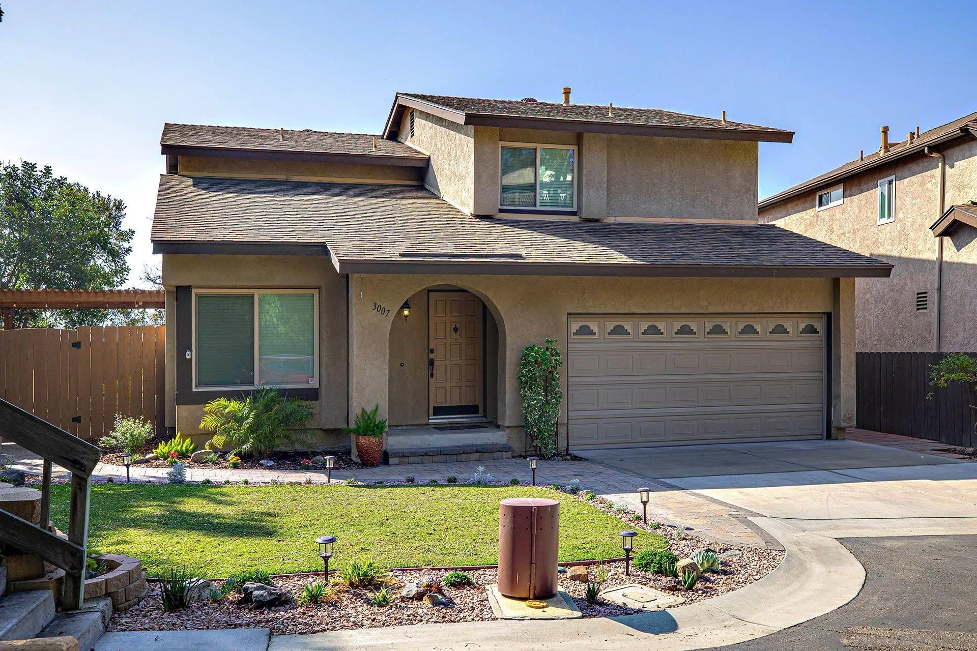 3007 Ruttles Court Spring Valley, CA 91978 - Photo 1 of 22 a front view of a house with garden