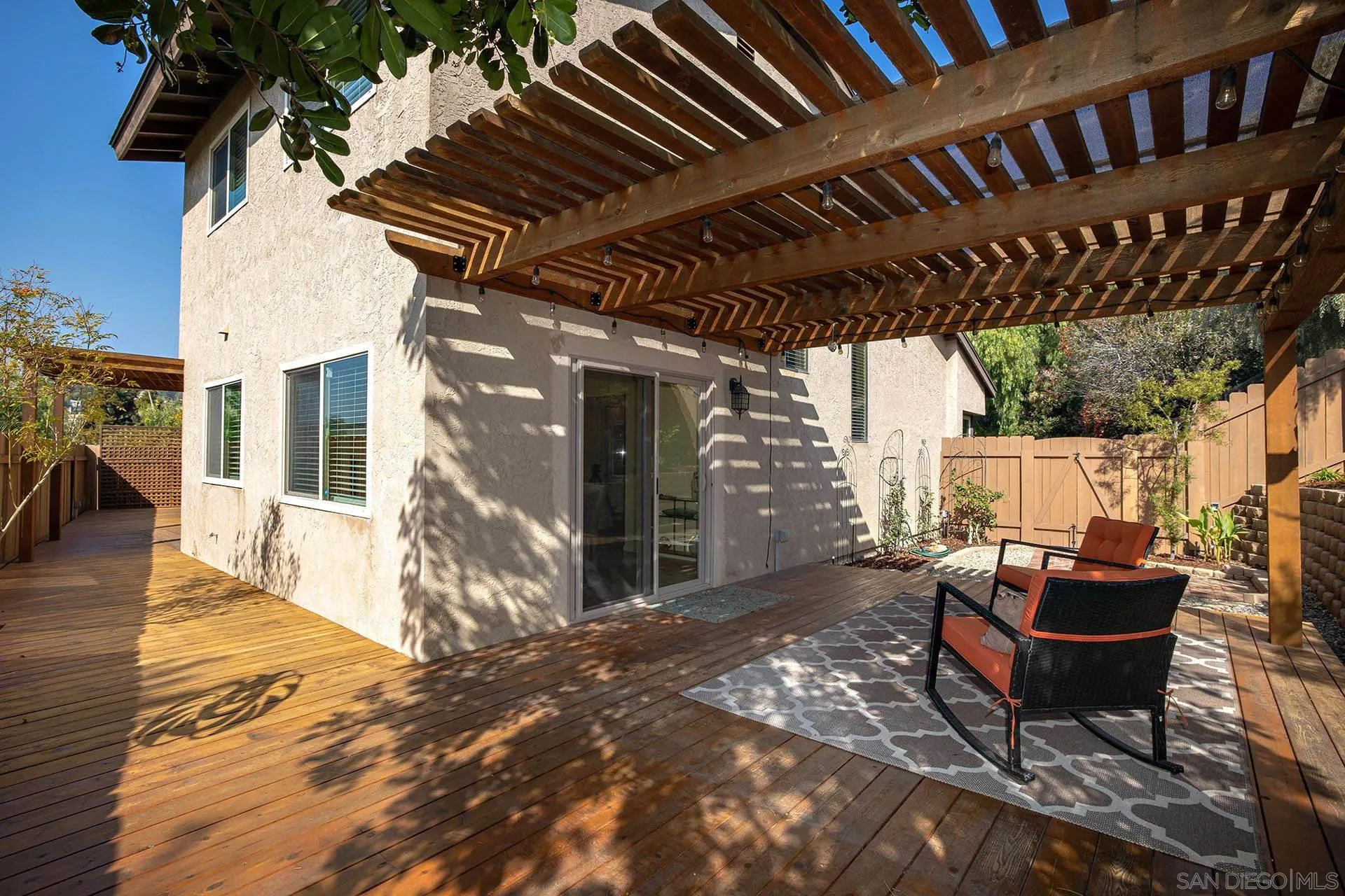 3007 Ruttles Court Spring Valley, CA 91978 - Photo 11 of 22 a backyard of a house with barbeque oven table and chairs