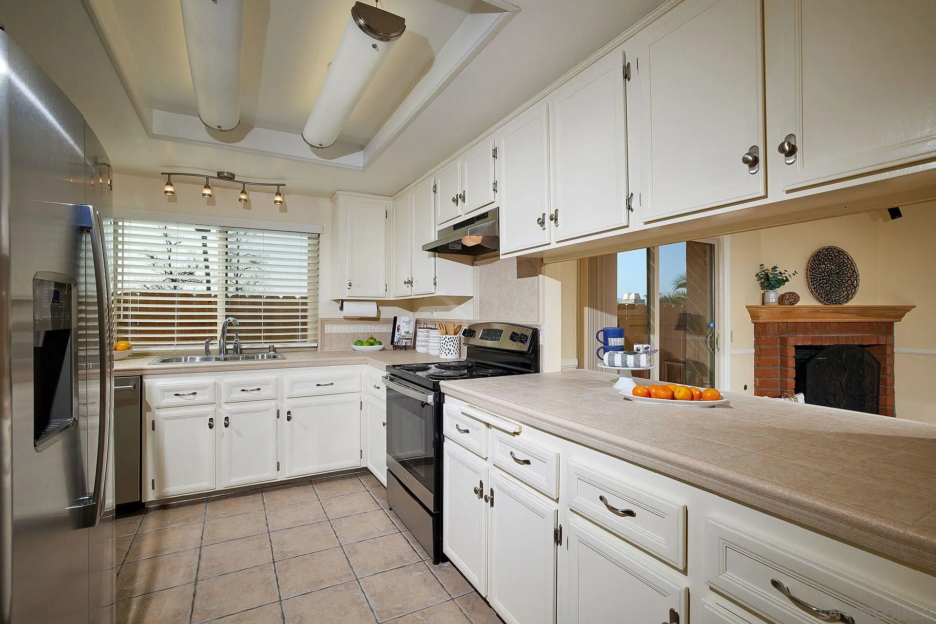 3007 Ruttles Court Spring Valley, CA 91978 - Photo 4 of 22 a kitchen with stainless steel appliances granite countertop a sink and cabinets