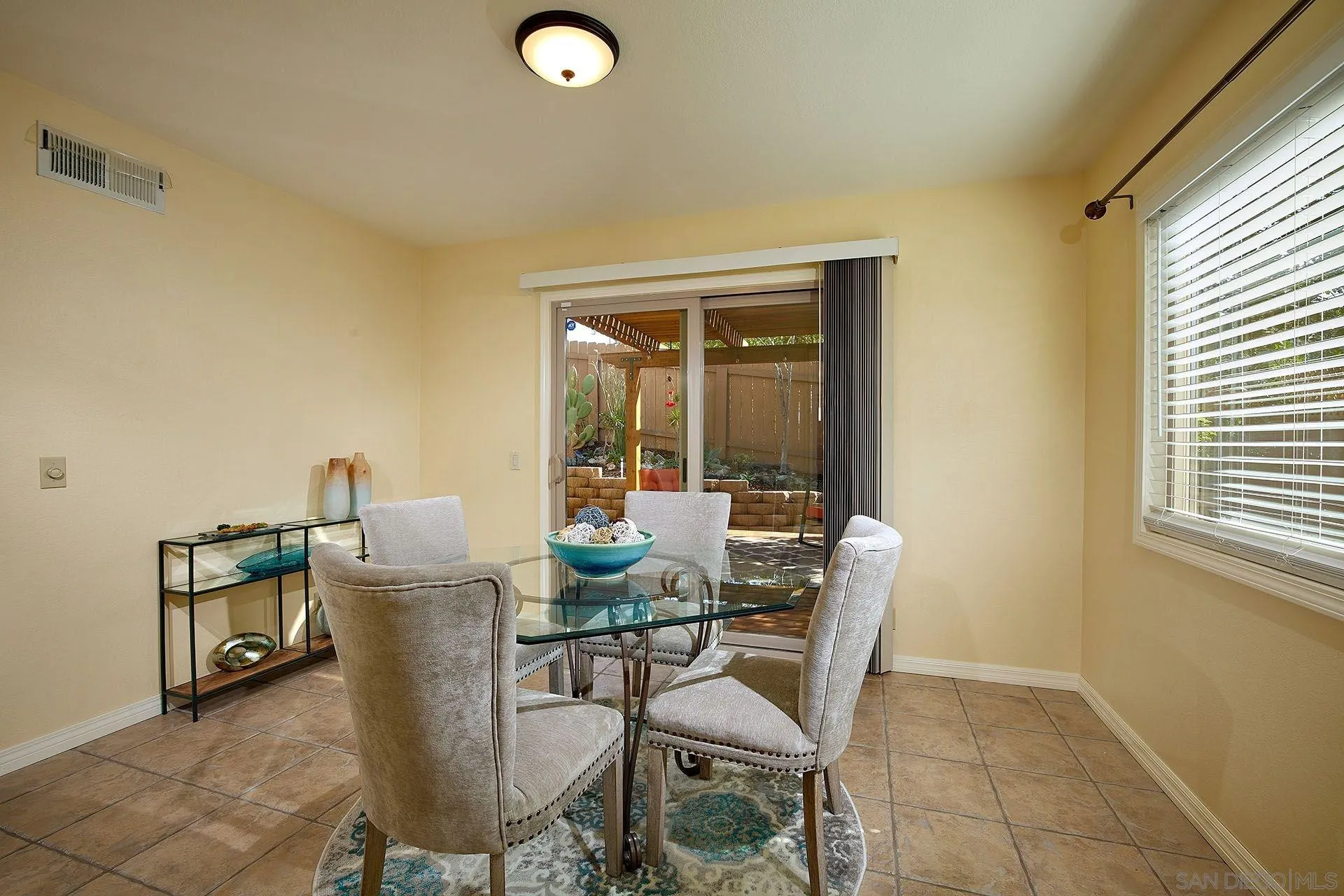 3007 Ruttles Court Spring Valley, CA 91978 - Photo 8 of 22 a dining room with furniture and a window