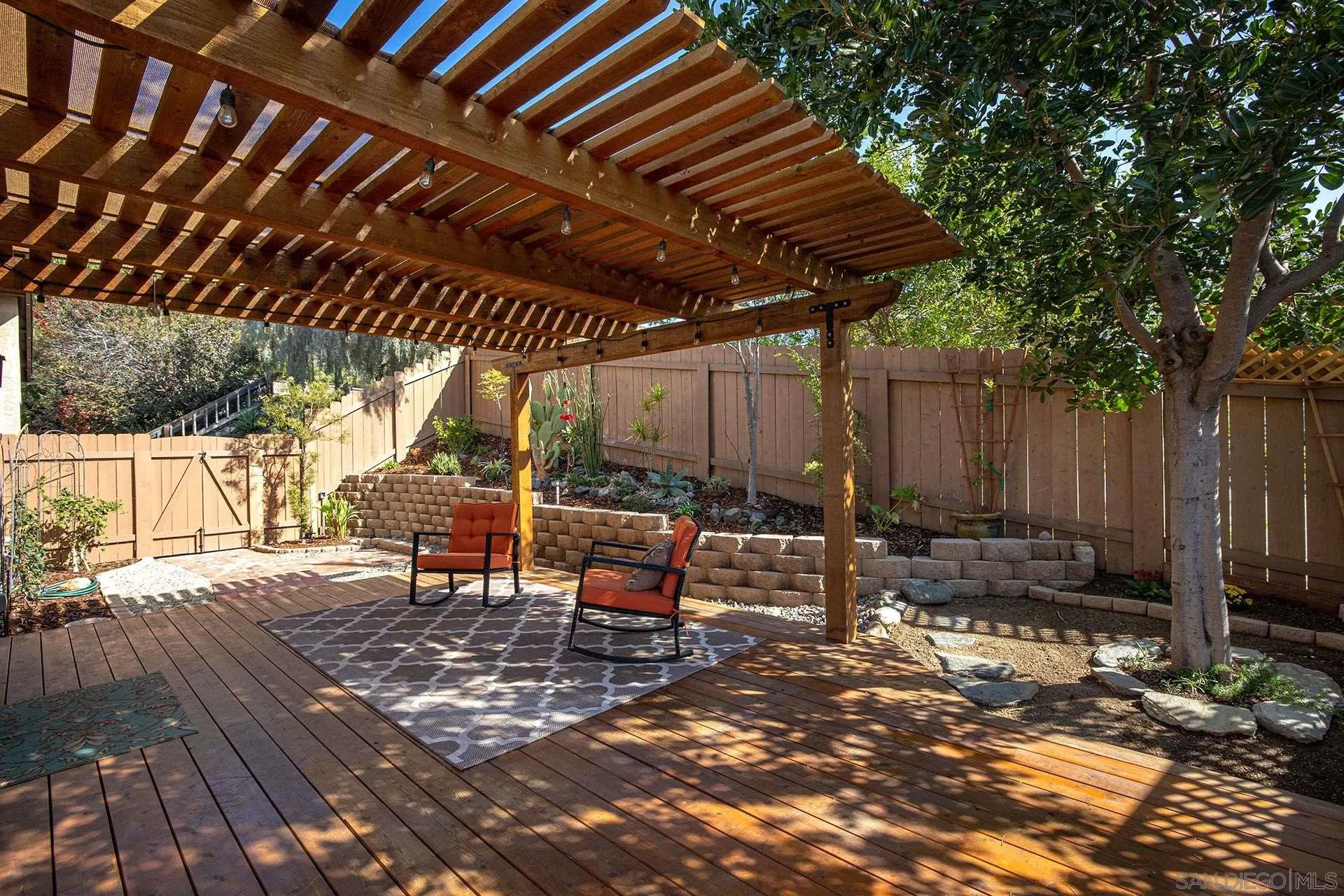3007 Ruttles Court Spring Valley, CA 91978 - Photo 10 of 22 a view of a patio with table and chairs and wooden floor