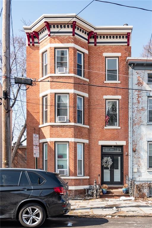 a front view of a house with parking space