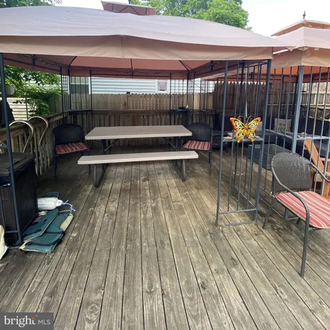 a large bed sitting in a bedroom next to a window