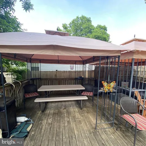 a kitchen with lots of counter top space and wooden floor