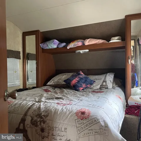 a view of a lush green outdoor space with a lake view