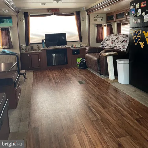 a view of house with yard and staircase