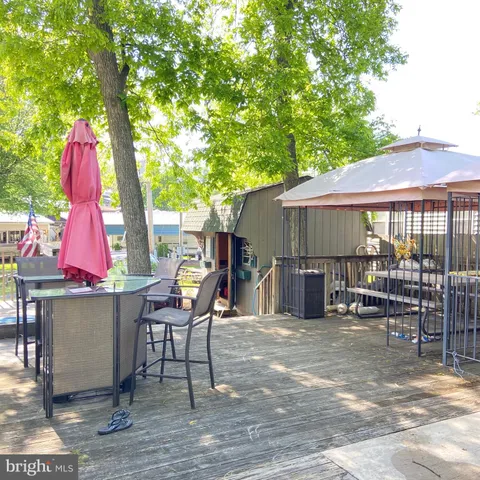 a view of a yard with furniture and a fire pit