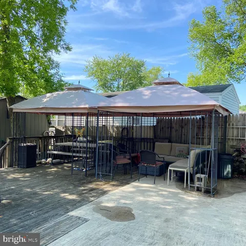 a bathroom with a granite countertop sink and mirror