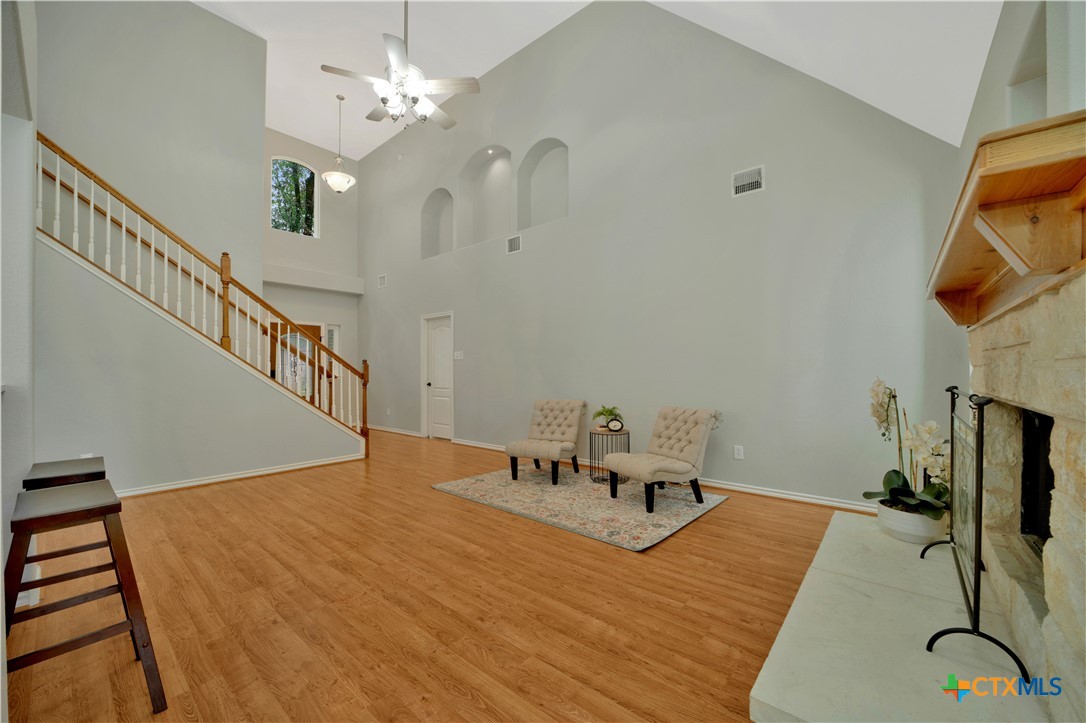 103 Sierra Ridge Drive San Marcos, TX 78666 - Photo 11 of 43 a bedroom with a bed and a chandelier