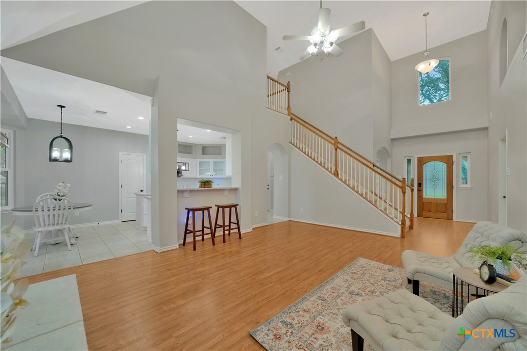 103 Sierra Ridge Drive San Marcos, TX 78666 - Photo 12 of 43 a view of a livingroom with furniture and a kitchen