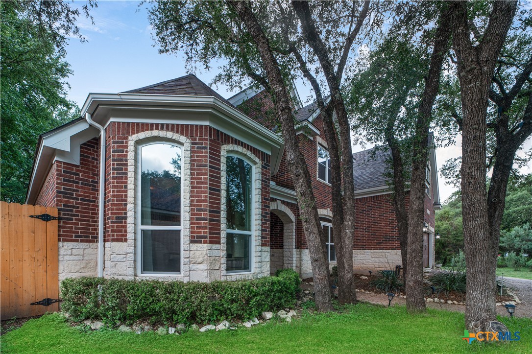103 Sierra Ridge Drive San Marcos, TX 78666 - Photo 2 of 43 front view of a house with a small yard