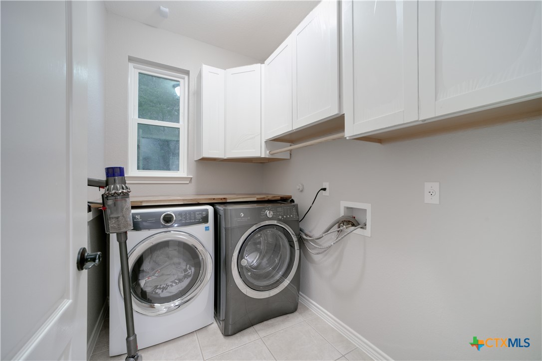 103 Sierra Ridge Drive San Marcos, TX 78666 - Photo 21 of 43 a utility room with sink dryer and washer