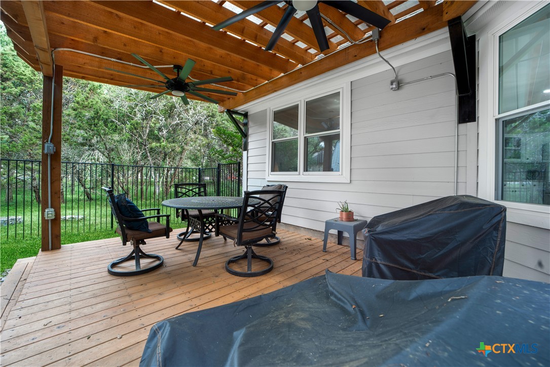 103 Sierra Ridge Drive San Marcos, TX 78666 - Photo 36 of 43 a view of a lounge chairs in back yard of the house