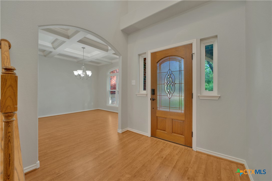 103 Sierra Ridge Drive San Marcos, TX 78666 - Photo 8 of 43 a view of a hallway with wooden floor