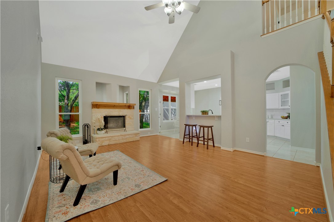 103 Sierra Ridge Drive San Marcos, TX 78666 - Photo 10 of 43 a living room with furniture and a fireplace