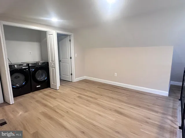 an empty room with wooden floor