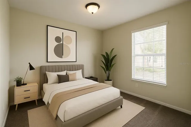 a bedroom with bed and a window