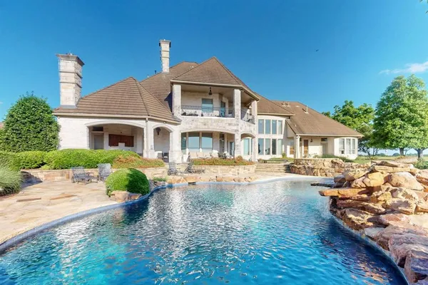 a front view of a house with swimming pool