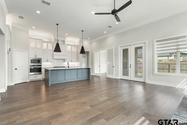 a view of kitchen with cabinets and wooden floor