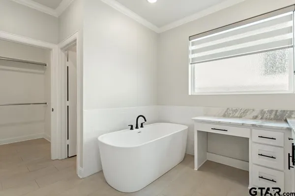 a bathroom with a sink and a bathtub