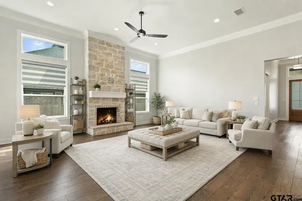 a living room with furniture and a fireplace