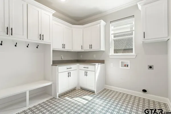 a kitchen with granite countertop white cabinets and white appliances