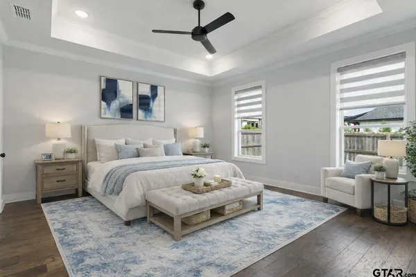 a bedroom with a large bed and a couch