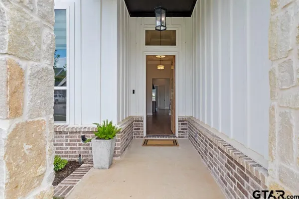 a potted plant sitting in front of a door