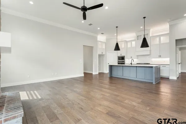 a view of kitchen with furniture and wooden floor