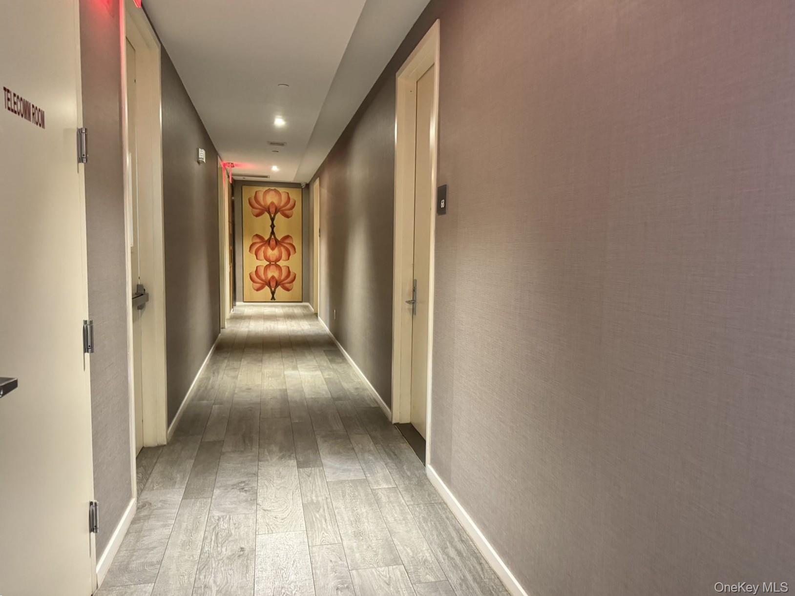 24-12 42nd Road, Unit 6C Queens, NY 11101 - Photo 9 of 12 a view of gallery with wooden floor