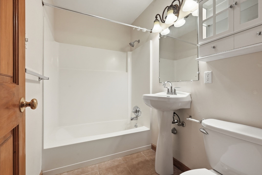 170 East Hadley Road, Unit 96 Amherst, MA 01002 - Photo 18 of 36 a bathroom with a sink a toilet and shower