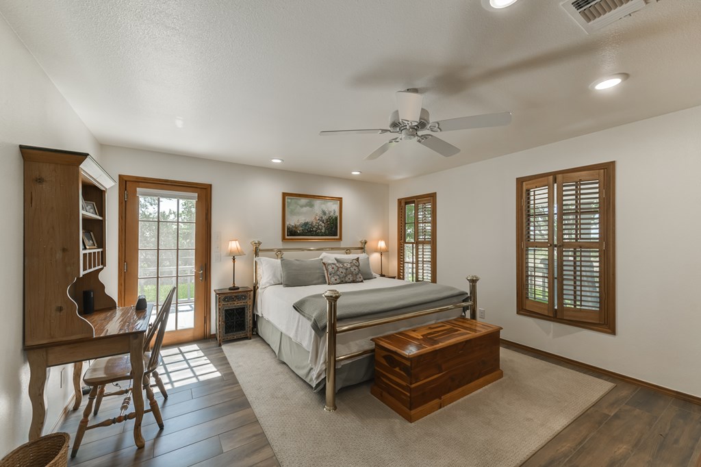 0 County Road Evant, TX 76525 - Photo 35 of 41 a bedroom with a bed wooden floor and window