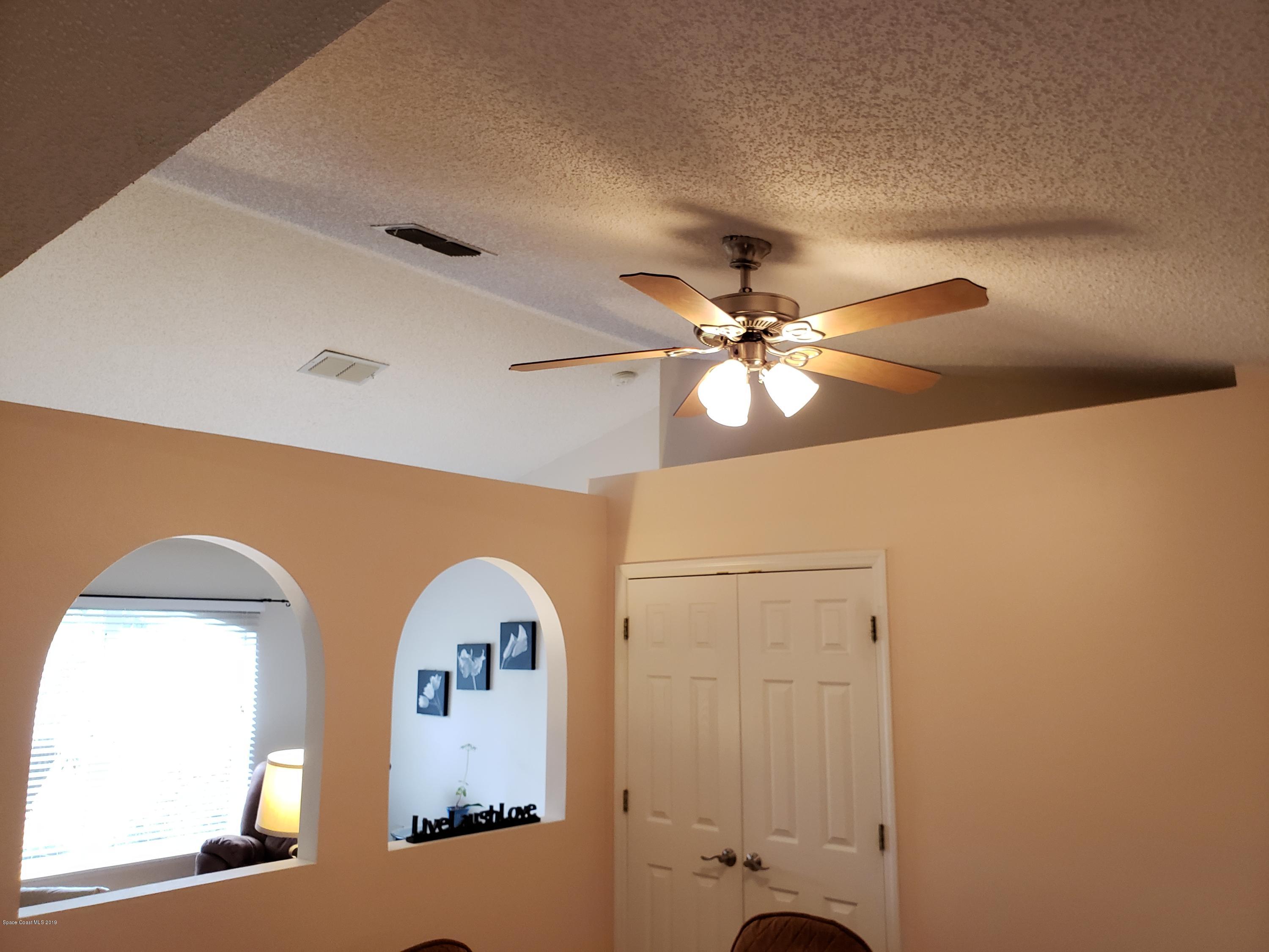 6145 Adina Road Cocoa, FL 32927 - Photo 14 of 34 a view of a hallway with entryway
