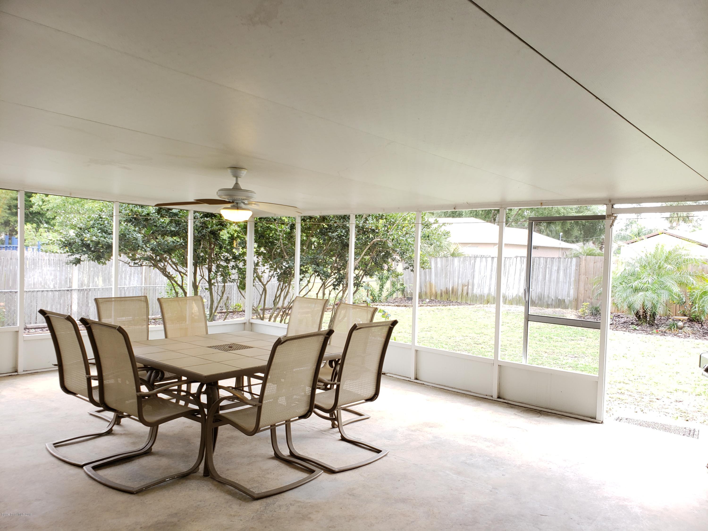 6145 Adina Road Cocoa, FL 32927 - Photo 22 of 34 a view of a dining room with furniture wooden floor and a potted plant