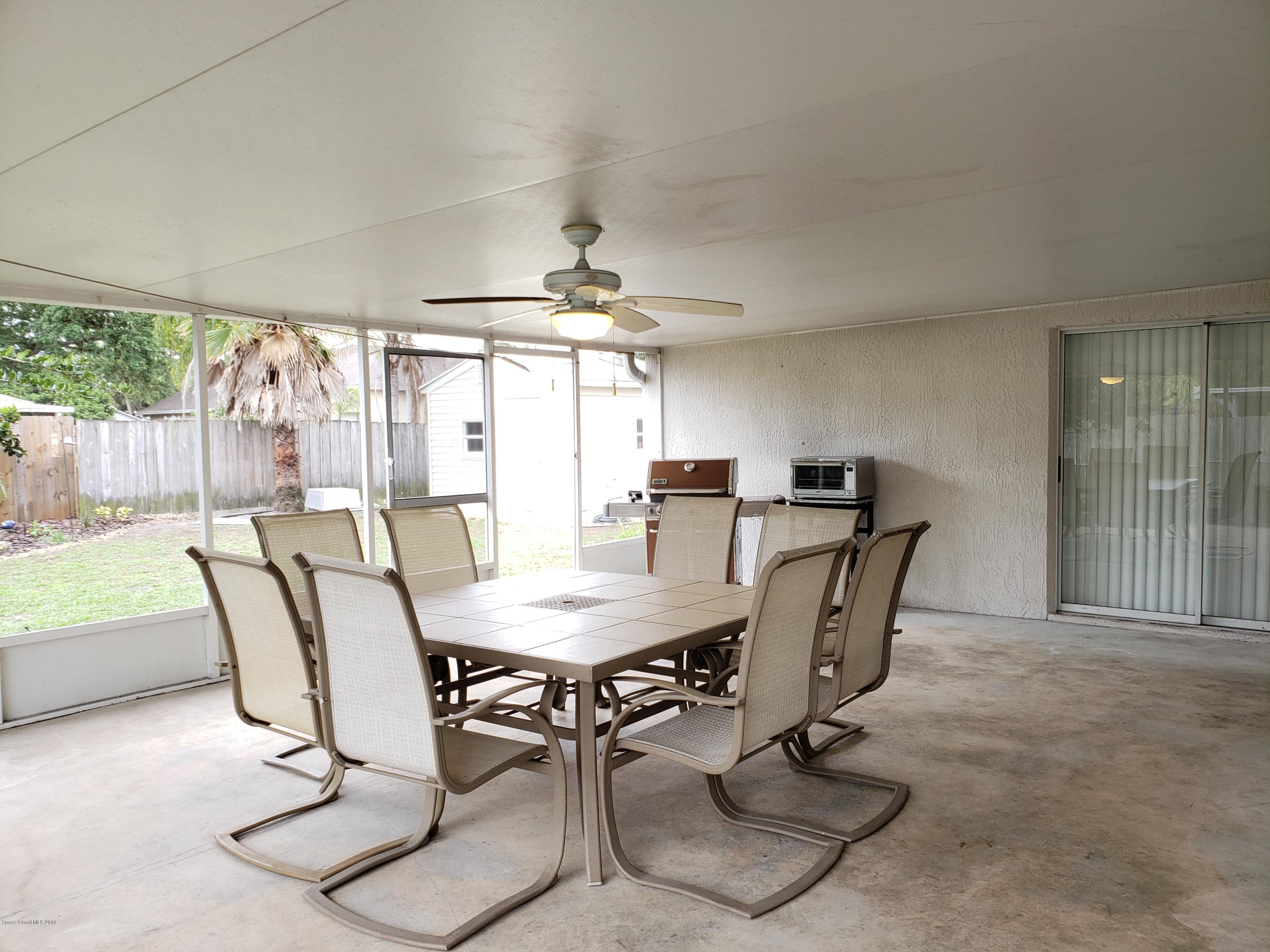 6145 Adina Road Cocoa, FL 32927 - Photo 23 of 34 a view of a dining room with furniture window and outside view
