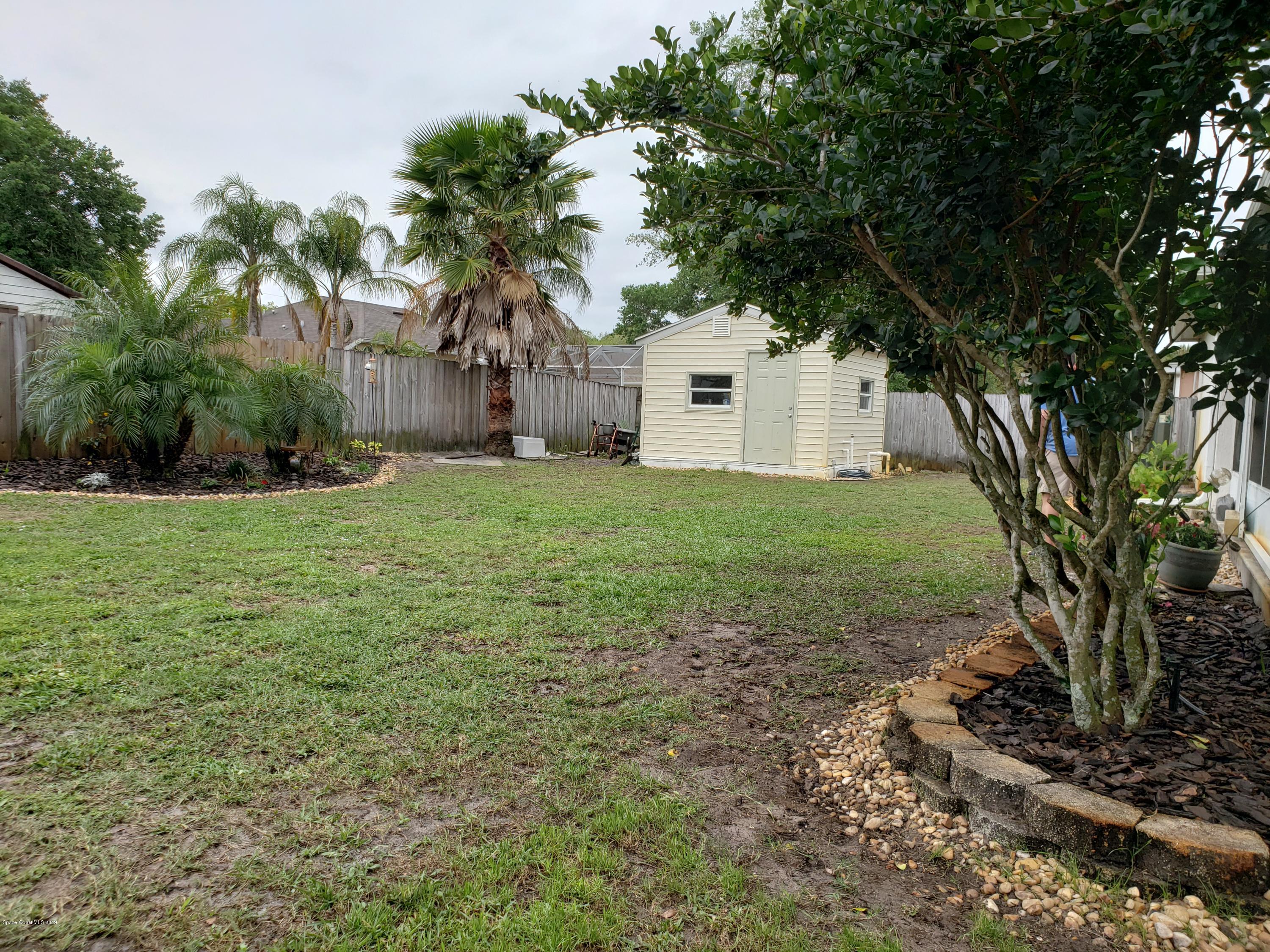 6145 Adina Road Cocoa, FL 32927 - Photo 30 of 34 a house view with a garden space