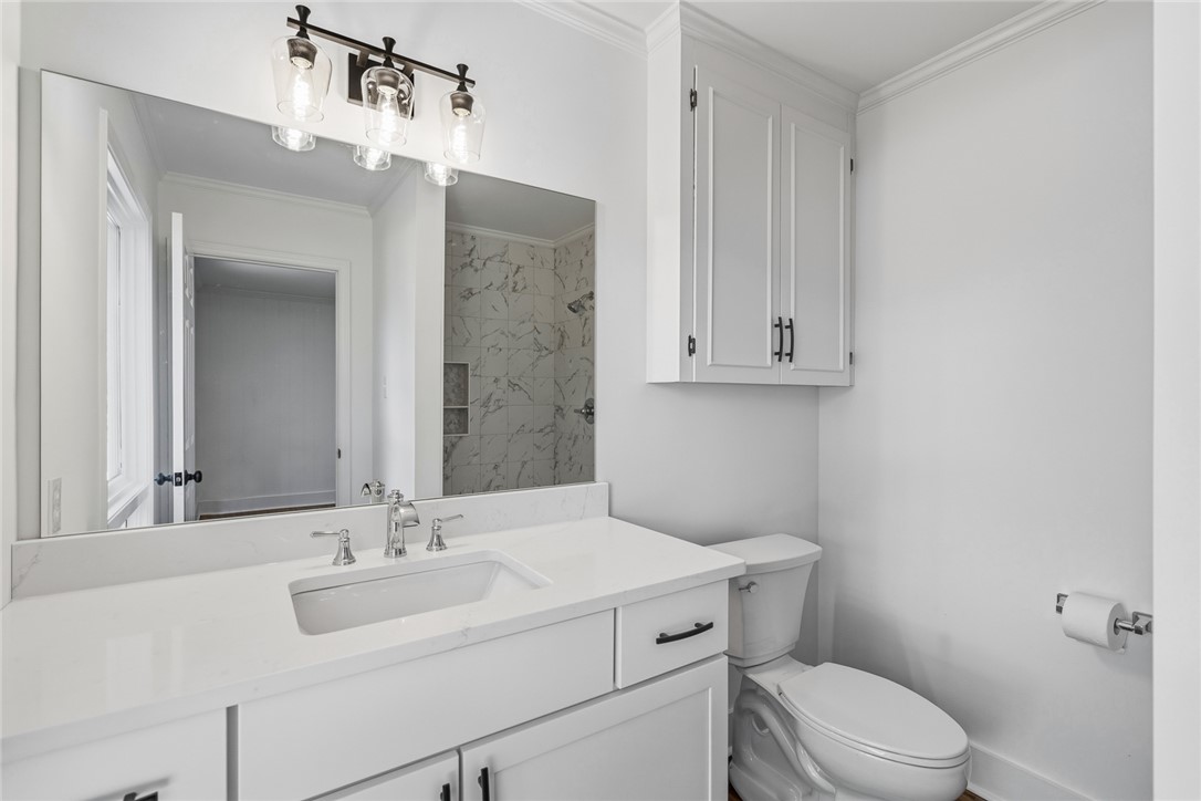 208 Williamsburg Road Anderson, SC 29621 - Photo 29 of 48 Crisp trim work and stone counters define this immaculately updated bathroom.