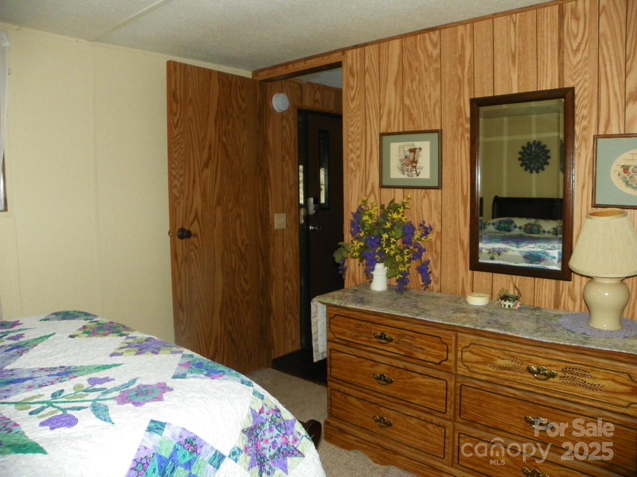 116 3rd Avenue New London, NC 28127 - Photo 16 of 18 a bedroom with a bed and a dresser