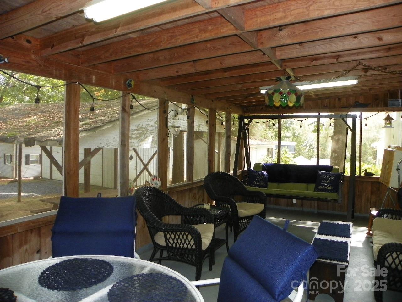 116 3rd Avenue New London, NC 28127 - Photo 4 of 18 a living room with furniture and a floor to ceiling window