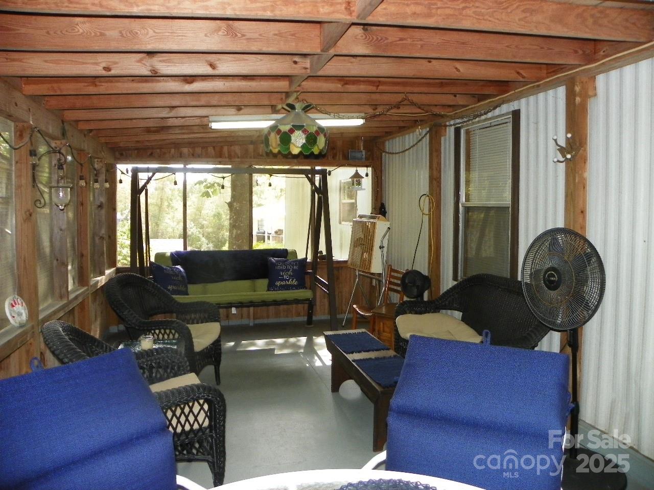 116 3rd Avenue New London, NC 28127 - Photo 5 of 18 a living room with furniture and a chandelier