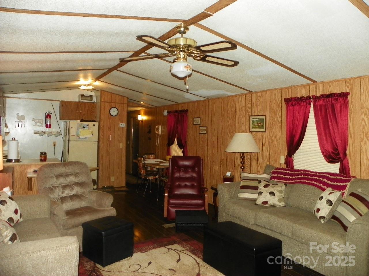 116 3rd Avenue New London, NC 28127 - Photo 7 of 18 a living room with furniture a air conditioner and a dining table