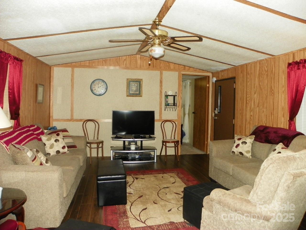 116 3rd Avenue New London, NC 28127 - Photo 8 of 18 a living room with furniture and a flat screen tv