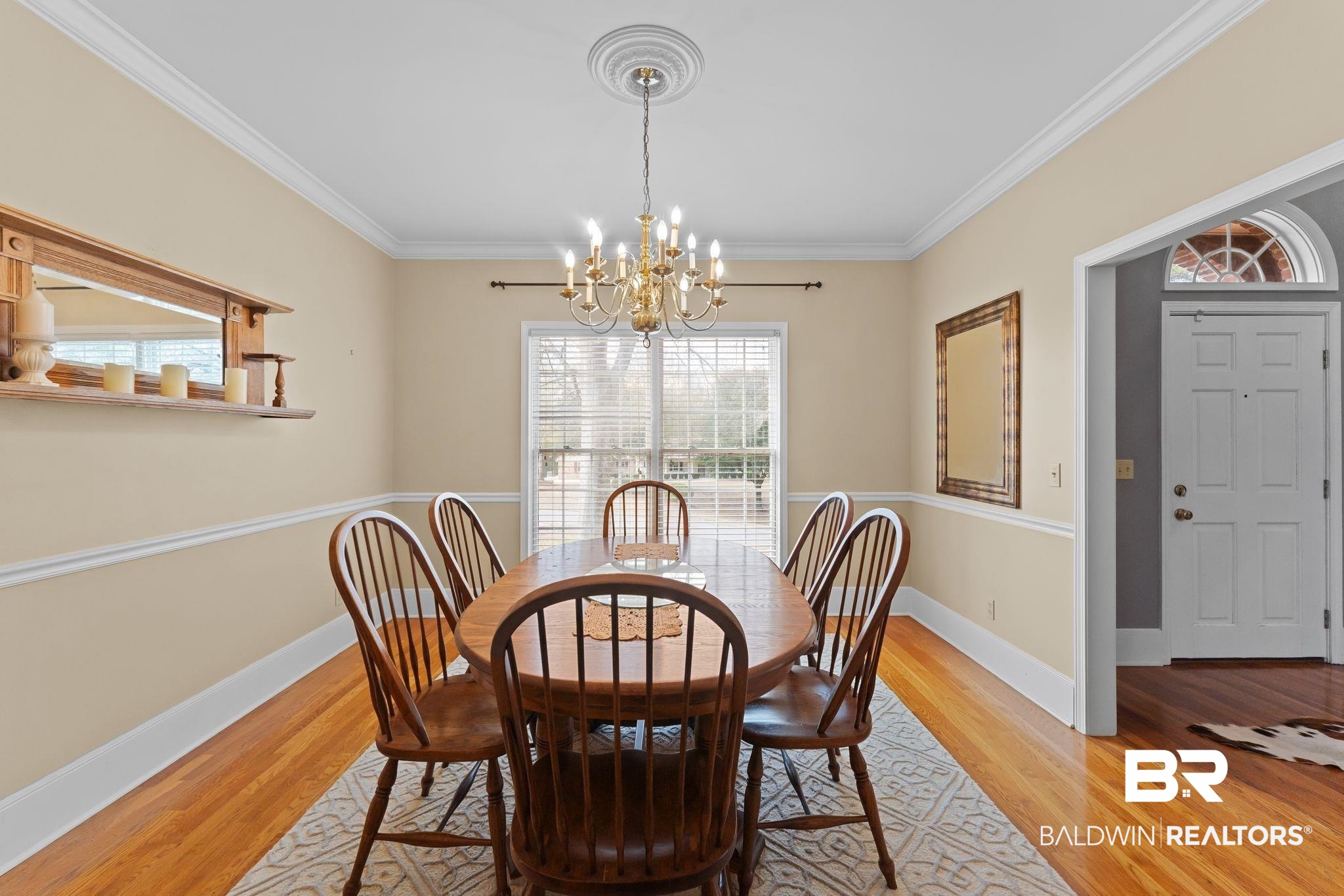 525 Norwood Road Monroeville, AL 36460 - Photo 11 of 55 Dining area with light wood-style flooring, healthy amount of natural light, a chandelier, and crown molding
